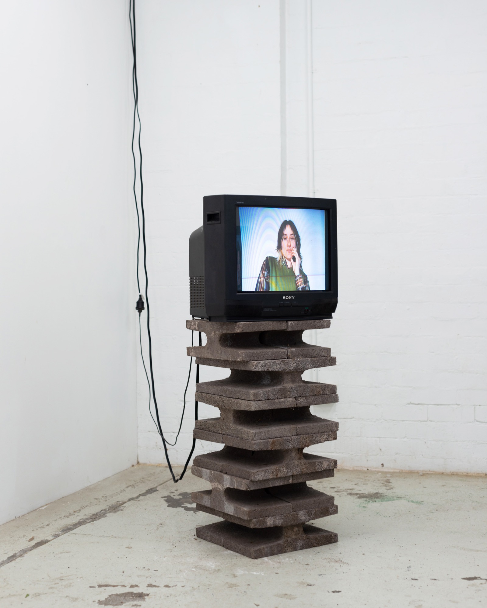 Auto Pilot, single CRT television on a concrete plinth showing a video portrait