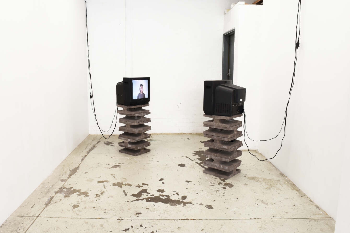 Auto Pilot, two CRT televisions facing each other on concrete plinths