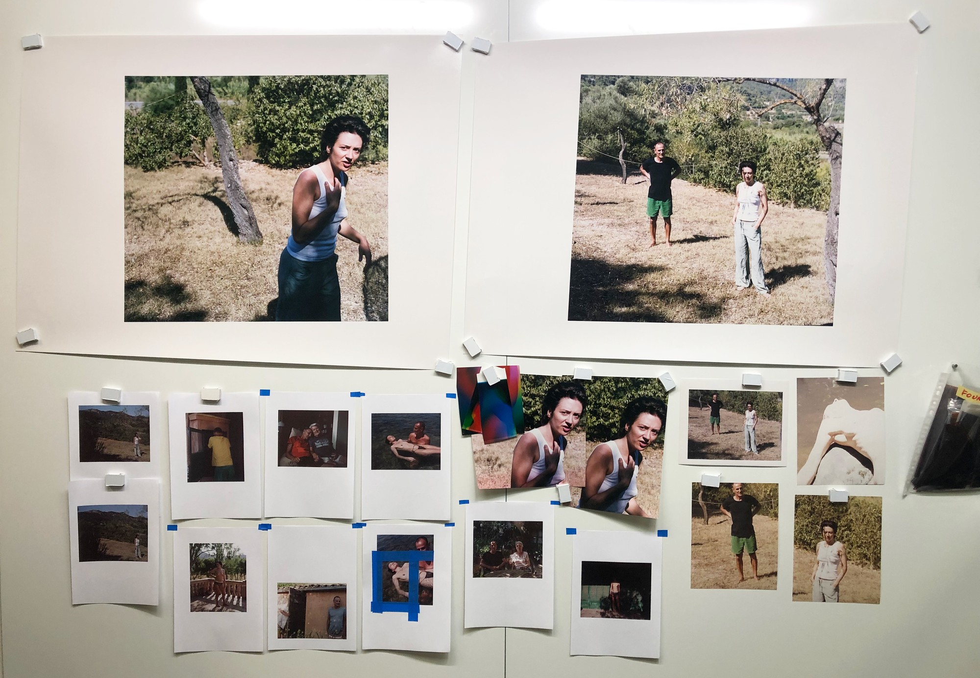 Studio wall with work prints pinned up during development